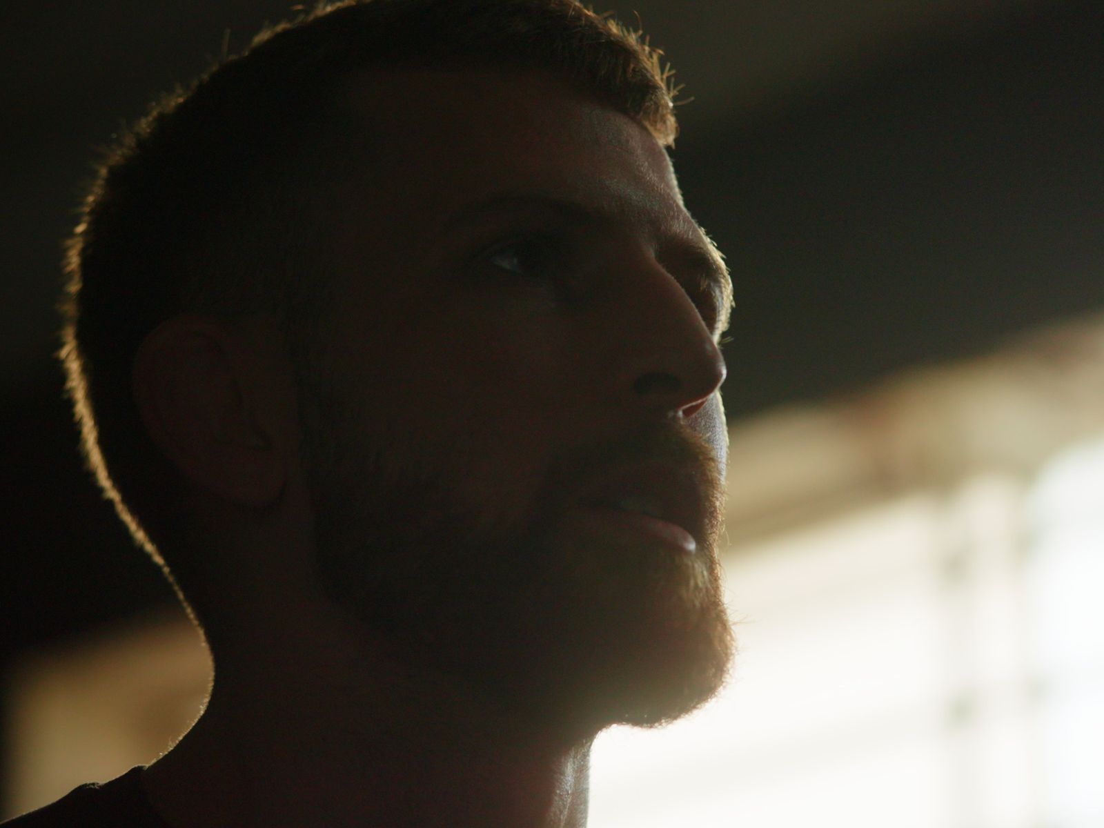 Close profile of a fighter in warm light